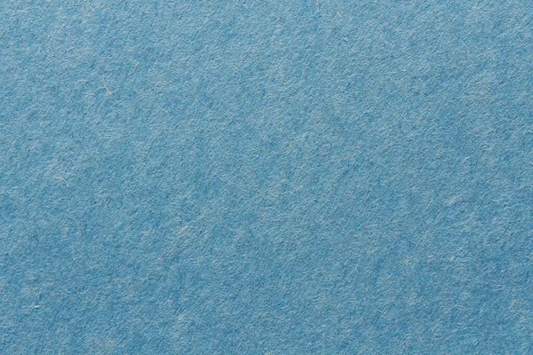 Colored Construction Paper. Close up view of Colored Construction Paper. Backgrounds and Textures. Opacity filter used to lighten and grade the image. Blue Construction Paper. Close Up view of Blue Construction or Craft Paper. Colored paper.
