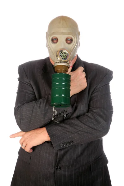 Gas Mask. A business man wears a gas mask. isolated on white. Room for text. Clipping Path. Businessman wearing anti gas mask.