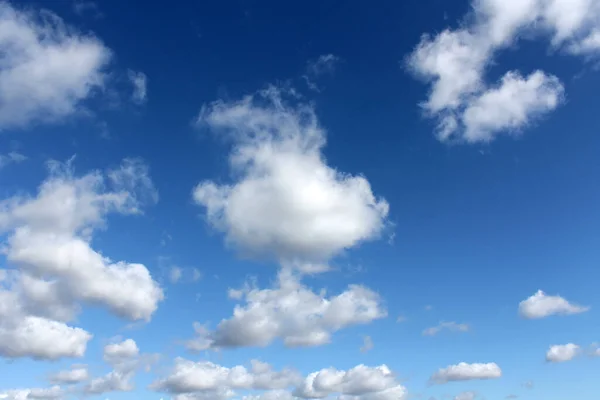 Blue Sky with clouds. A beautiful blue sky with white fluffy clouds. Blue sky with clouds and sun.