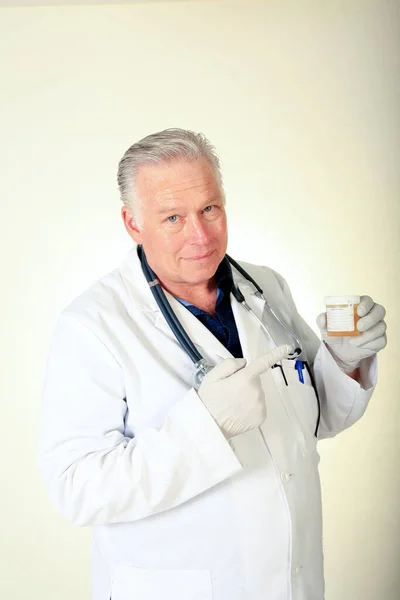 Doctor. Handsome Male Doctor. Portrait of a friendly handsome doctor in his lab coat. smiling mature doctor. Male doctor standing in the hospital office. Medical healthcare and doctor service. Handsome middle-aged Caucasian male professional doctor.