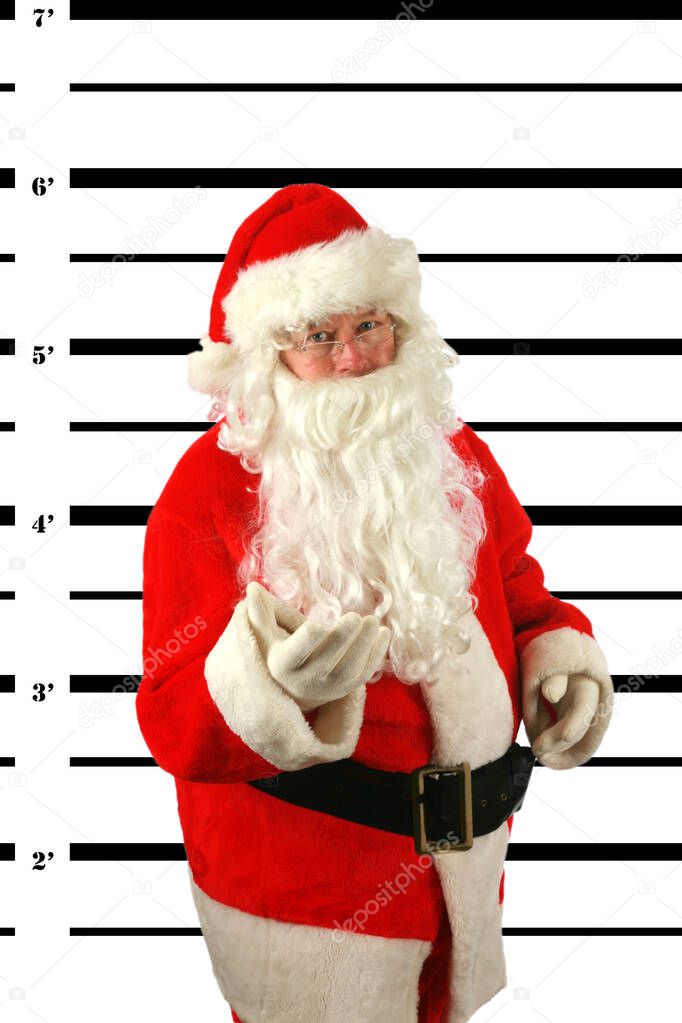 Christmas. Santa Claus is Under Arrest. Police Booking Photo. Santa Claus is under arrest for Eating Donuts during Christmas. BUSTED. Santa Claus is arrested and his MUG SHOT taken at the Police Station. Santa tried to Bribe the Police with Donuts.