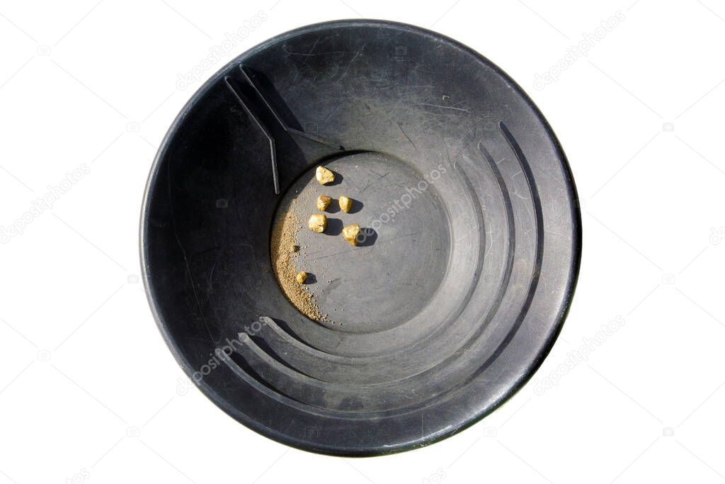 Gold. Gold Pan. Gold Panning. Gold Mining. A black Gold Pan with Gold Nuggets. Isolated on white. Room for text. Clipping Path. A Miner Gold panning. A man striking it rich by finding the mother lode or at least a nugget or two. 