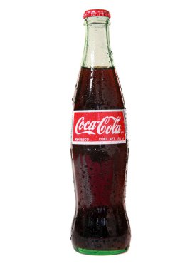 Coca Cola. Bir şişe Coca Cola. Yazı işleri. Cam şişedeki bir şişe Coca-Cola klasiğinin fotoğrafı. Meksika 'da yapılan Coca Cola gerçek Şeker Çubuğu şekerinden yapılır. 250 gram Coca-Cola. Coca-Cola dünyanın favori karbonlu içeceğidir.. 