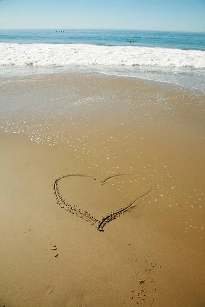 Heart. Heart Shape. Heart Drawing. Heart drawn in the sand at the beach. I love the beach. Heart symbol on beach, Hand drawn heart on beach sand over sunset or sunrise sky beautiful light nature landscape.