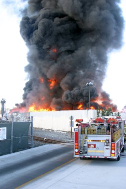 Emergency. Fire. HARBOR GATEWAY, CALIFORNIA- DECEMBER 12, 2015: Fire erupts at recycling yard in Harbor Gateway. Dozens of Fire Trucks arrive to help extinguish an industrial fire, California Dec. 12, 2015.  Editorial. Emergency Services. 