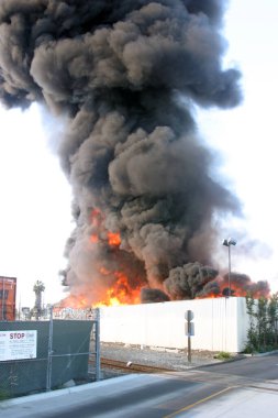 Emergency. Fire. HARBOR GATEWAY, CALIFORNIA- DECEMBER 12, 2015: Fire erupts at recycling yard in Harbor Gateway. Dozens of Fire Trucks arrive to help extinguish an industrial fire, California Dec. 12, 2015.  Editorial. Emergency Services. 