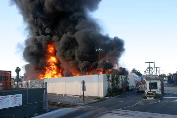 HARBOR GATEWAY, CALIFORNIA- DECEMBER 12, 2015: Fire erupts at recycling yard in Harbor Gateway. Dozens of Fire Trucks arrive to help extinguish an industrial fire, California Dec. 12, 2015. editorial. Emergency Response. Suspicious Fire. 