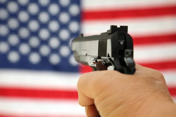 Gun. American Flag. .45 caliber pistol with an American Flag background. 2nd Amendment. Second Amendment. Represents 2nd Amendment. the right to bare arms. Civil Liberty. Personal Protection. Protection of life and property. Gun Control. Pistol.
