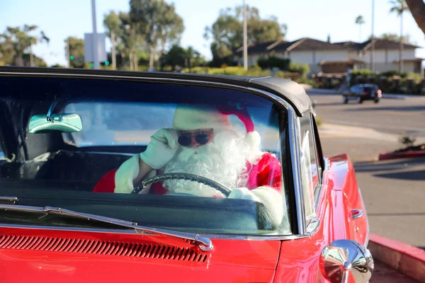 Christmas. Santa Claus. Hot Rod Car. Santa Claus drives his Hot Rod Car. Santa Drives his car. Santa Claus arrives in style. Santa Cruises in his Classic Car. Santa Claus Drives. Santa Claus Car. Santa Claus on vacation. Santa Claus with his car.