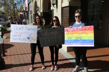 SANTA ANA, CALIFORNIA - JANUARY 21, 2017: People from Orange County carry signs, and wear t-shirts with slogans marched in Santa Ana today for the Orange County Women's March. Editorial. Pink Pussy Hat Protest March. pink pussy hats. 