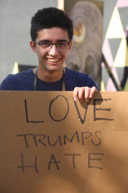 SANTA ANA, CALIFORNIA - JANUARY 21, 2017: People from Orange County carry signs, and wear t-shirts with slogans marched in Santa Ana today for the Orange County Women's March. Editorial. Pink Pussy Hat Protest March. pink pussy hats. 