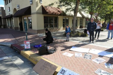 SANTA ANA, CALIFORNIA - JANUARY 21, 2017: People from Orange County carry signs, and wear t-shirts with slogans marched in Santa Ana today for the Orange County Women's March. Editorial. Pink Pussy Hat Protest March. pink pussy hats. 