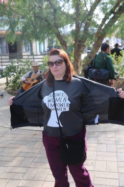 SANTA ANA, CALIFORNIA - JANUARY 21, 2017: Angry Women's March carry signs, and wear t-shirts with slogans marched in Santa Ana today for the Orange County Women's March. President Donald J. Trump Protesters. Pink Pussy Hats. Protest Signs. Mad Women.