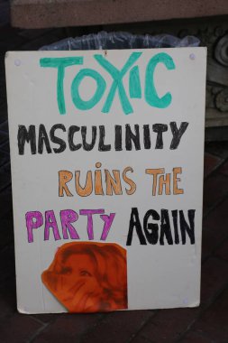 SANTA ANA, CALIFORNIA - JANUARY 21, 2017: Angry Women's March carry signs, and wear t-shirts with slogans marched in Santa Ana today for the Orange County Women's March. President Donald J. Trump Protesters. Pink Pussy Hats. Protest Signs. Mad Women.