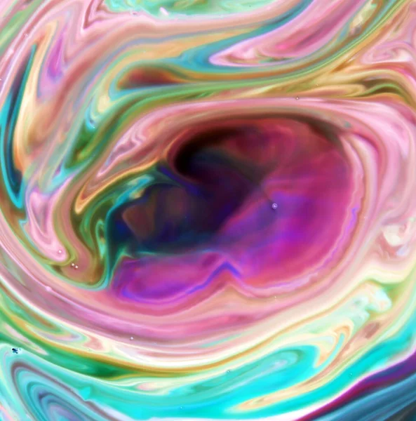 Abstract colors, backgrounds and textures. Food Coloring in milk. Magic Milk. Milk, Food Coloring and dish soap. Food coloring in milk creating bright colorful backgrounds. Colorful chemical experiment. Food coloring in milk in a psychedelic pattern.
