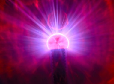 Close up view of a Plasma lamp. The plasma lamp was invented by Nikola Tesla, during his experimentation with high-frequency currents in an evacuated glass tube for the studying high voltage.