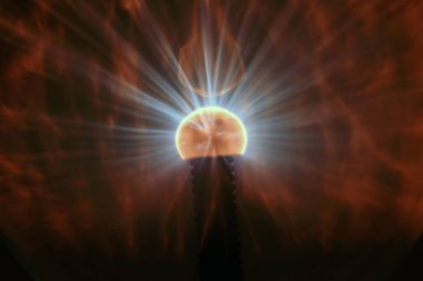 Close up view of a Plasma lamp. The plasma lamp was invented by Nikola Tesla, during his experimentation with high-frequency currents in an evacuated glass tube for the studying high voltage.
