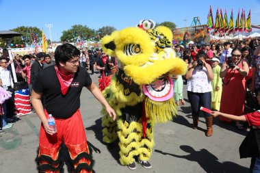 Costa Mesa CA. - 2/17/18 TET Festival featuring a Lion Dance in which performers mimic a lion's movements in a lion costume to bring good luck and fortune.