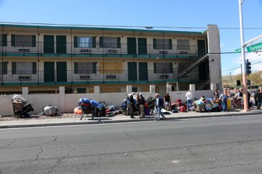 North Las Vegas, Nevada 3-15-2018: A homeless encampment outside of an abandoned and boarded up apartment building. Homelessness is a problem in many cities world wide, including Las Vegas Nevada.