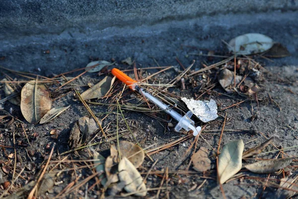 Hypodermic Needles discarded onto the sidewalks and in the dirty gutters of all major cities and towns. Drug abuse is out of control in many states with heroin being the main drug of choice.