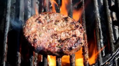 Hamburger grilling on a Barbecue. Barbecue Grill with Hamburger. Burger on grill