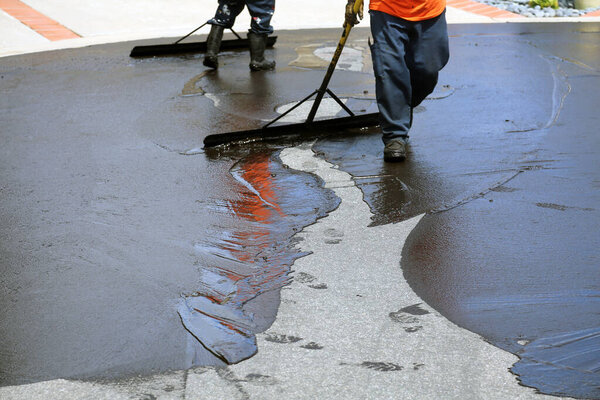 Private drive way, street rehabilitation and slurry seal project finished with crews expertly applying the slurry seal. Re-surfaced Cul-de-sac shown with unidentifiable crew working