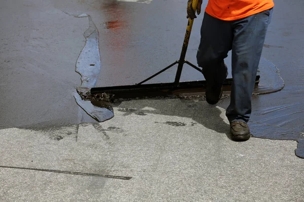 Private drive way, street rehabilitation and slurry seal project finished with crews expertly applying the slurry seal. Re-surfaced Cul-de-sac shown with unidentifiable crew working