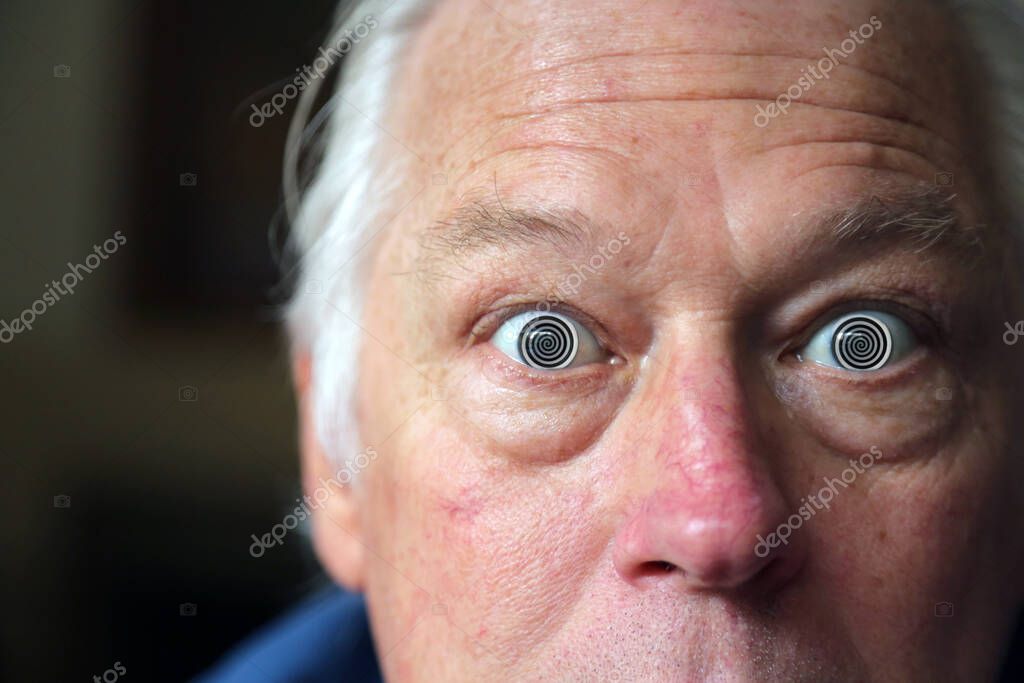 Man with Hypnotic Eyes. A man stares at you with his Hypnotic Eyes, soon you will be Hypnotized. Hypnosis.