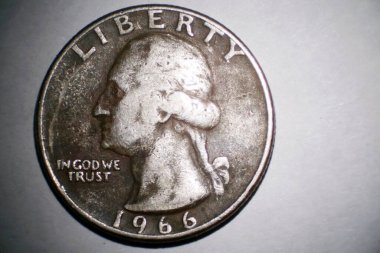 Microscopic view of a 1966 Quarter. 1966 .25 cent piece seen under a microscope for a close up.
