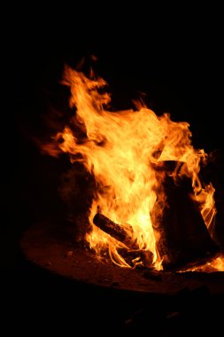 Halloween. Hell Fire. Fire. Burning Flames of Fire. Wood Fire. Bonfire on a beach in a fire pit. Hot Burning flames of fire. Hot Flames of fire from the pits of Hell. Souls damned to hell burn in Satan's Fires for all eternity. Fire and Brimstone. 