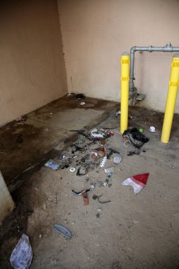 8-27-2018 Santa Ana California: Trash and Urine Soaked space under stairs of a building outside in Santa Ana California. Homeless issues are a major concern in many cities world wide.