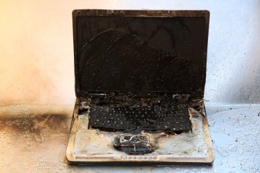 Laptop Computer Damage. Fire and Water Damage of a Laptop Computer. Insurance claim