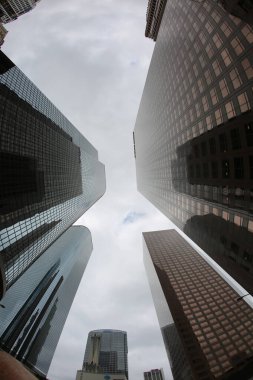 Fish Eye Lens View of Skyscrapers seen from the ground up. Sky Scrapers photographed through a Fish Eye lens. Downtown buildings in any large city. Los Angeles, Chicago, New York, Tokyo.