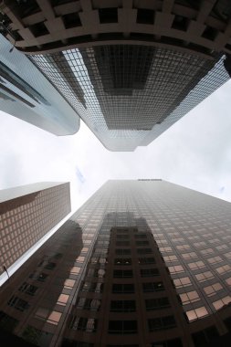 Fish Eye Lens View of Skyscrapers seen from the ground up. Sky Scrapers photographed through a Fish Eye lens. Downtown buildings in any large city. Los Angeles, Chicago, New York, Tokyo.