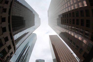 Fish Eye Lens View of Skyscrapers seen from the ground up. Sky Scrapers photographed through a Fish Eye lens. Downtown buildings in any large city. Los Angeles, Chicago, New York, Tokyo.