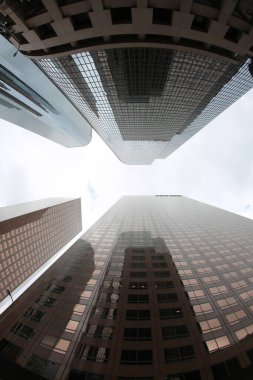 Fish Eye Lens View of Skyscrapers seen from the ground up. Sky Scrapers photographed through a Fish Eye lens. Downtown buildings in any large city. Los Angeles, Chicago, New York, Tokyo.