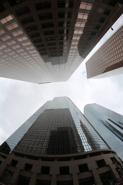 Fish Eye Lens View of Skyscrapers seen from the ground up. Sky Scrapers photographed through a Fish Eye lens. Downtown buildings in any large city. Los Angeles, Chicago, New York, Tokyo.