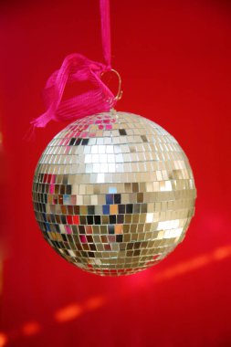 Silver Mirror Ball with a Christmas Red Background