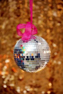 Silver Mirror Ball with Gold Sequin Background. Disco Ball with Gold backdrop. Disco Party. Dance Party.