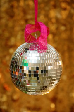 Silver Mirror Ball with Gold Sequin Background. Disco Ball with Gold backdrop. Disco Party. Dance Party.