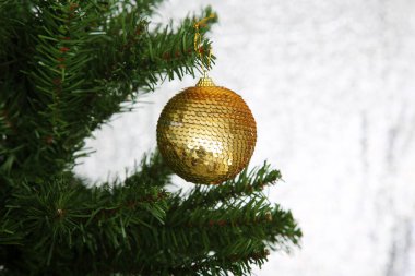 Christmas tree with ornament on a silver background