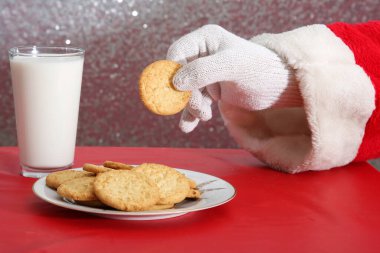Christmas Cookies. Cookies and Milk. Santa Claus with milk and cookies.
