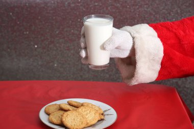 Christmas Cookies. Cookies and Milk. Santa Claus with milk and cookies.