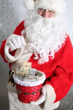 Santa Claus. Christmas Charity and Donations. Santa collects money for the needy or donations for the poor.