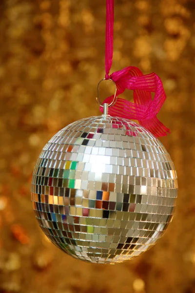 Silver Mirror Ball with Gold Sequin Background. Disco Ball with Gold backdrop. Disco Party. Dance Party.