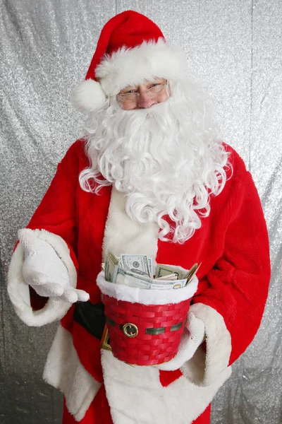 Santa Claus. Christmas Charity and Donations. Santa collects money for the needy or donations for the poor.