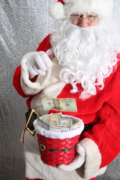 Santa Claus. Christmas Charity and Donations. Santa collects money for the needy or donations for the poor.