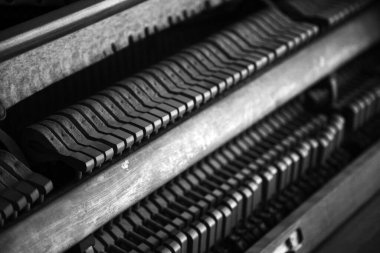 piano. inside a piano view in black and white.