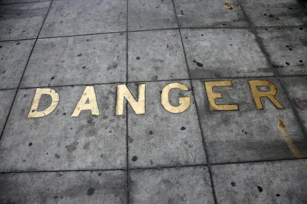 Metal Words Sidewalk Old Metal Words Imbedded Cement Word Danger — Zdjęcie stockowe