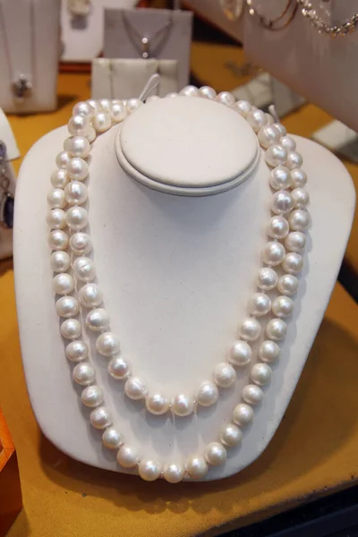 Pearl Necklace. Pearl Necklace on a manikin bust.